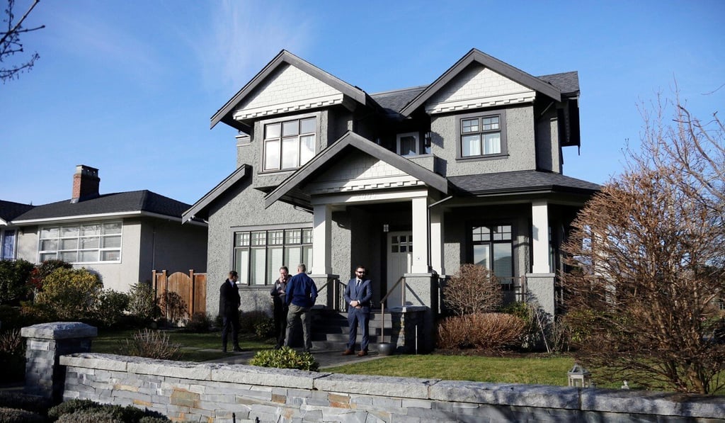 Members of a private security firm stand outside one of the homes owned by Meng Wanzhou, in the Vancouver neighbourhood of Dunbar, in January 2019. Photo: Reuters Members of a private security firm stand outside one of the homes owned by Meng Wanzhou, in the Vancouver neighbourhood of Dunbar, in January 2019. Photo: Reuters