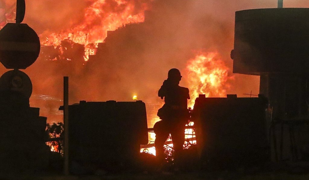 Riot police charge into Hong Kong Polytechnic University in November 2019 after mass exchanges of tear gas and petrol bombs. The city was on the brink of chaos for more than six months. Photo: Sam Tsang