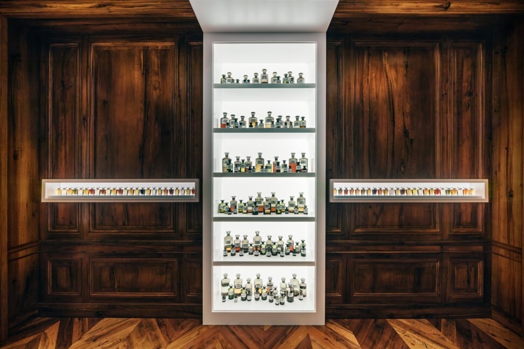 A wall of flasks, beakers and containers of essences, set between shelves of perfume bottles, greets visitors to the new Henry Jacques boutique. Photo: Henry Jacques A wall of flasks, beakers and containers of essences, set between shelves of perfume bottles, greets visitors to the new Henry Jacques boutique. Photo: Henry Jacques