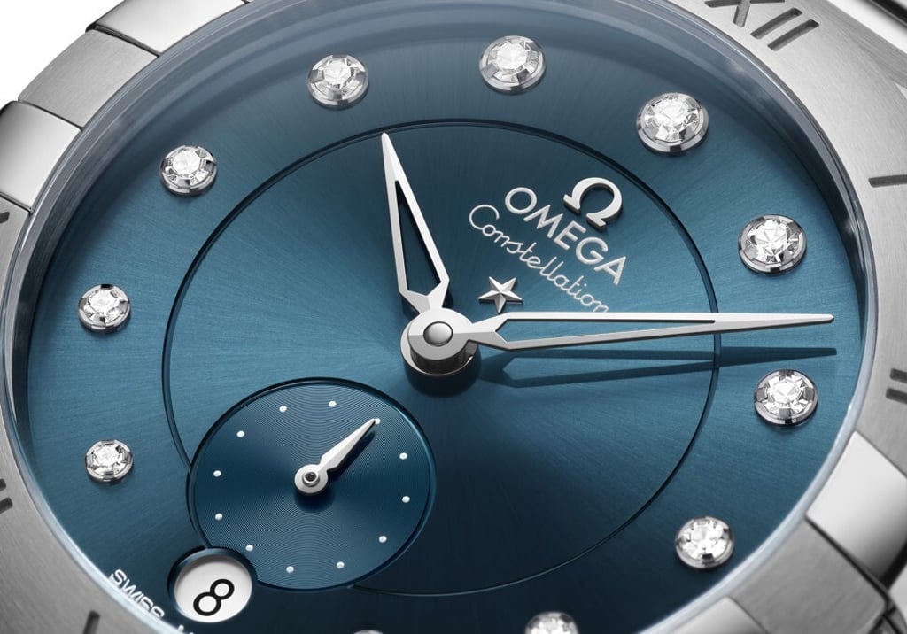 The new Constellation model, which is also being offered with a peacock blue dial, adds a small seconds subdial at 6 o’clock, where it intersects with the date window. Photo: Omega The new Constellation model, which is also being offered with a peacock blue dial, adds a small seconds subdial at 6 o’clock, where it intersects with the date window. Photo: Omega