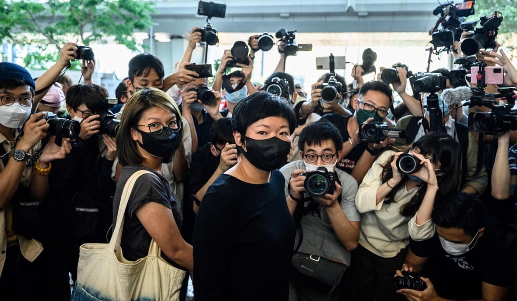RTHK contributor Bao Choy (centre) is surrounded by members of the press after being convicted of making a false statement last week. Photo: AFP RTHK contributor Bao Choy (centre) is surrounded by members of the press after being convicted of making a false statement last week. Photo: AFP