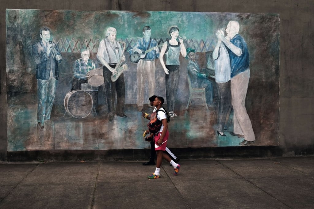 Teenagers walk through downtown in a rural Delta community on April 29 in Leland, Mississippi, a southern US state with pockets of entrenched poverty. US President Joe Biden has proposed to raise taxes on the rich to fund spending and tax credits meant to fight poverty and reduce child care costs for families, among other programmes. Photo: Getty Images / AFP Teenagers walk through downtown in a rural Delta community on April 29 in Leland, Mississippi, a southern US state with pockets of entrenched poverty. US President Joe Biden has proposed to raise taxes on the rich to fund spending and tax credits meant to fight poverty and reduce child care costs for families, among other programmes. Photo: Getty Images / AFP