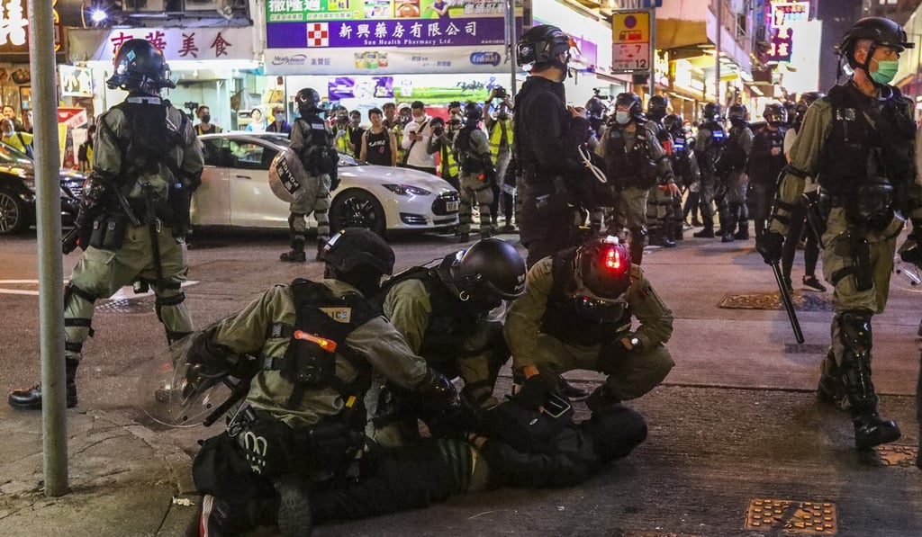 Riot police detain an anti-government protester during a demonstration in Mong Kok on February 29, 2020. Photo: Felix Wong Riot police detain an anti-government protester during a demonstration in Mong Kok on February 29, 2020. Photo: Felix Wong