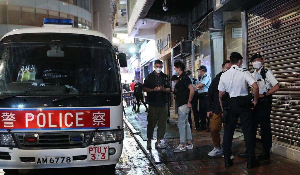 Police officers keep watch outside Beauty Mansion in Tsim Sha Tsui. Photo: Edmond So