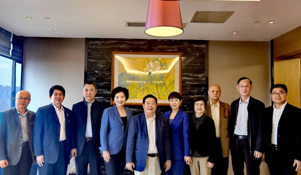 Cao Dewang, the founder of China’s largest car glassmaker Fuyao Glass Industry Group (fifth to left), plans to establish a technology university in his hometown of Fuzhou, China. Photo: Handout