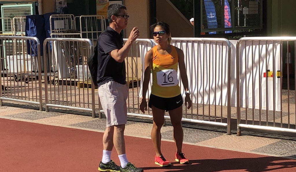 Christy Yiu and her coach Shinetsu Murao after a 5,000-metre race at Wan Chai Sports Ground. Photo: Chan Kin-wa Christy Yiu and her coach Shinetsu Murao after a 5,000-metre race at Wan Chai Sports Ground. Photo: Chan Kin-wa