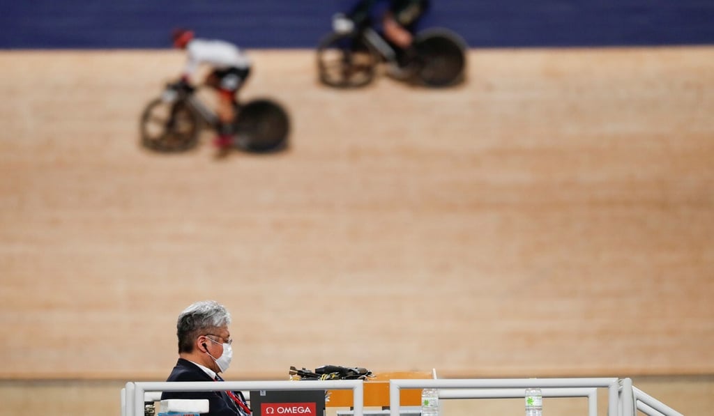 An official wears a face mask during the Tokyo 2020 Olympics test event at the Izu Velodrome in Shizuoka prefecture, Japan. Photo: Reuters