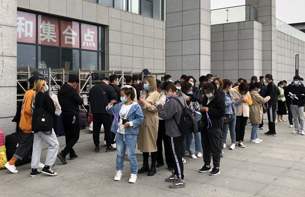 Jobseekers line up outside contract manufacturer Foxconn Technology Group’s production complex for iPhones in Zhengzhou, capital of central Henan province. Photo: SCMP Jobseekers line up outside contract manufacturer Foxconn Technology Group’s production complex for iPhones in Zhengzhou, capital of central Henan province. Photo: SCMP