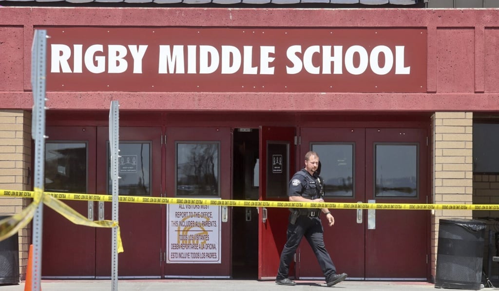 A police officer walks out of Rigby Middle School following a shooting there on Thursday. Photo: AP A police officer walks out of Rigby Middle School following a shooting there on Thursday. Photo: AP
