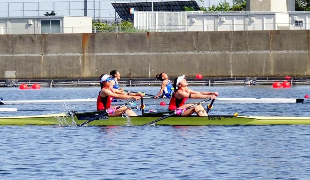 Hong Kong 's women's lightweight doubles at the finish line of their race in the Olympic qualifiers.