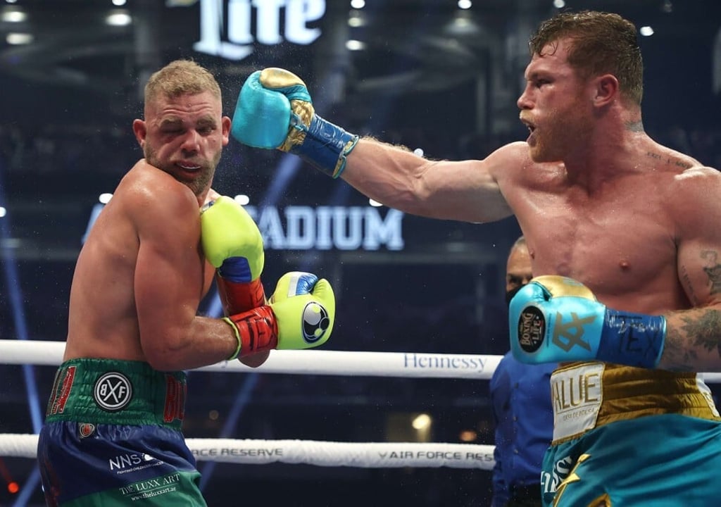Canelo Alvarez punches Billy Joe Saunders during their fight. Photo: AFP Canelo Alvarez punches Billy Joe Saunders during their fight. Photo: AFP