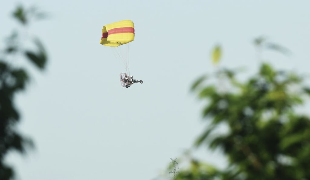 A spotter in a powered parachute was seen hovering over the search area. Photo: AP