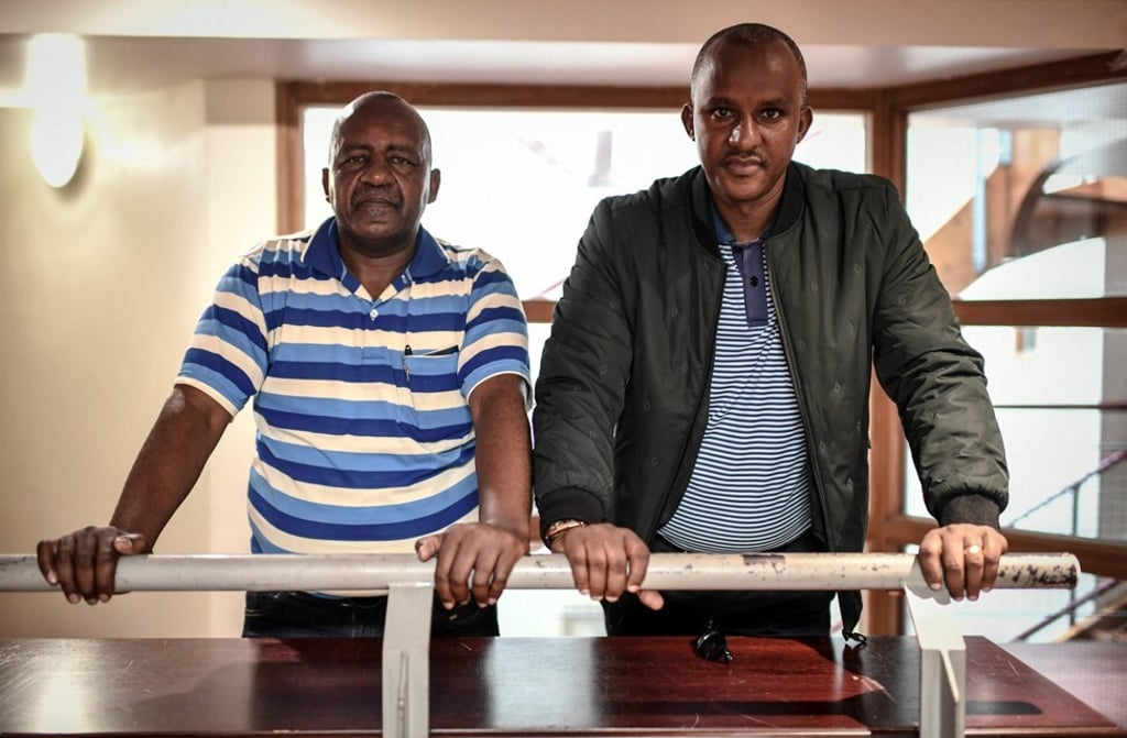 Rwandan genocide Tutsi survivors of the 1994 Bisesero massacre, Bernard Kayumba, right, and Eric Nzabihimana, photographed in 2019. Photo: AFP