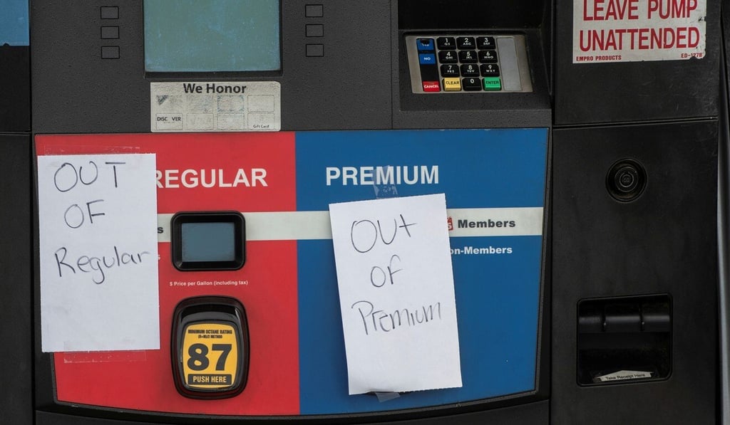 Signs at a petrol station in Norfolk, Virginia, on Tuesday say that there is no more regular or premium petrol available. Photo: Reuters