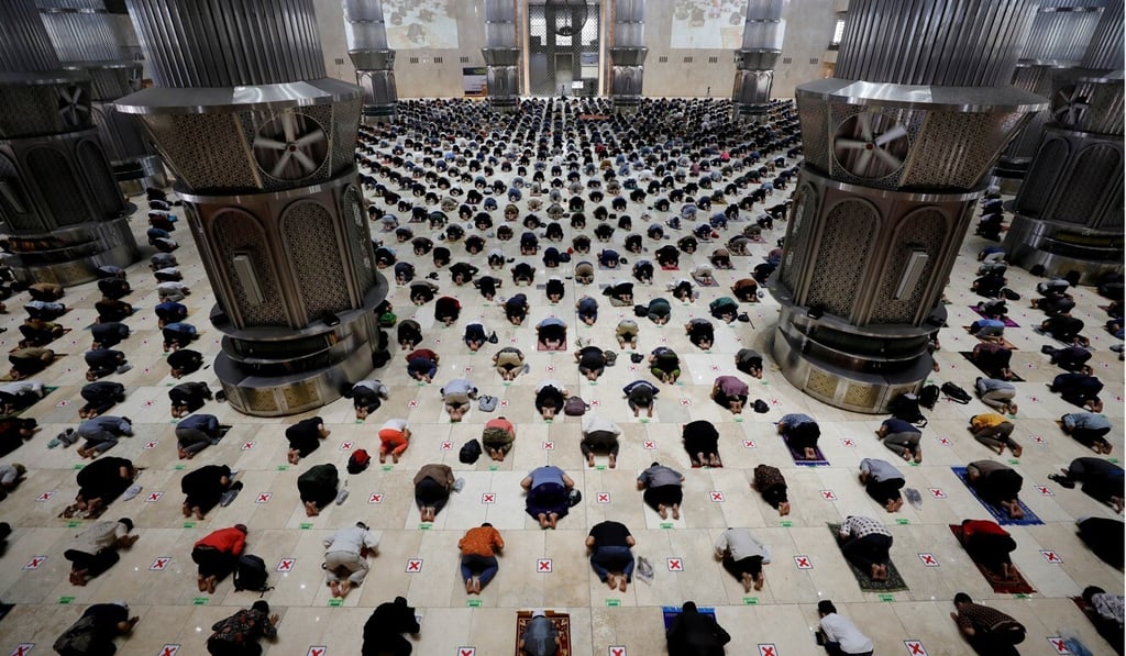 Muslim men maintain social distancing as they attend Friday prayers at Jakarta’s Istiqlal Great Mosque in April. Photo: Reuters