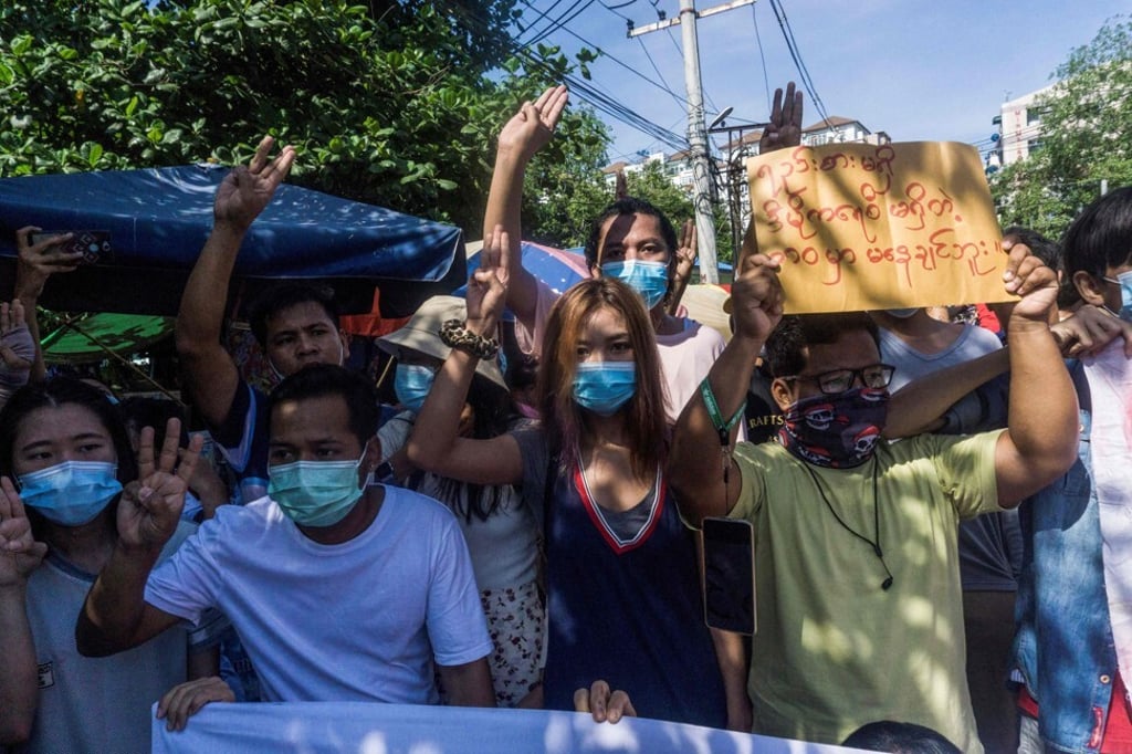 Protesters make the three-finger salute during a demonstration against the military coup in Yangon, Myanmar on May Friday. Photo: AFP