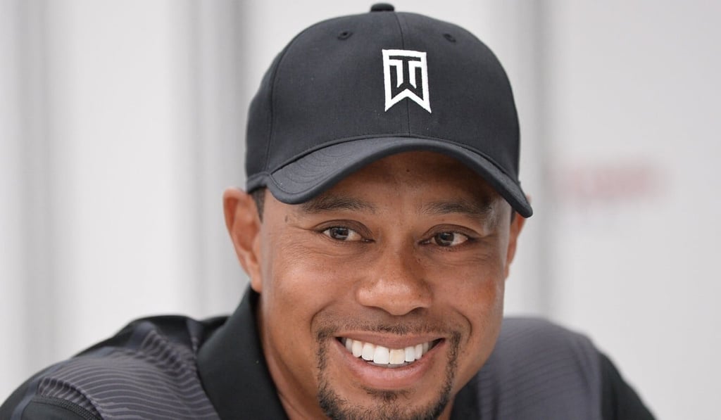 US golfer Tiger Woods smiles while speaking to the press in 2014. Photo: AFP