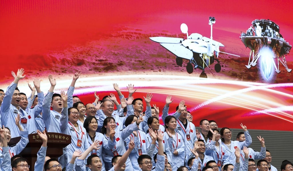 Members at the Beijing Aerospace Control Centre celebrate after China‘s Tianwen-1 probe successfully landed on Mars. Photo: Xinhua