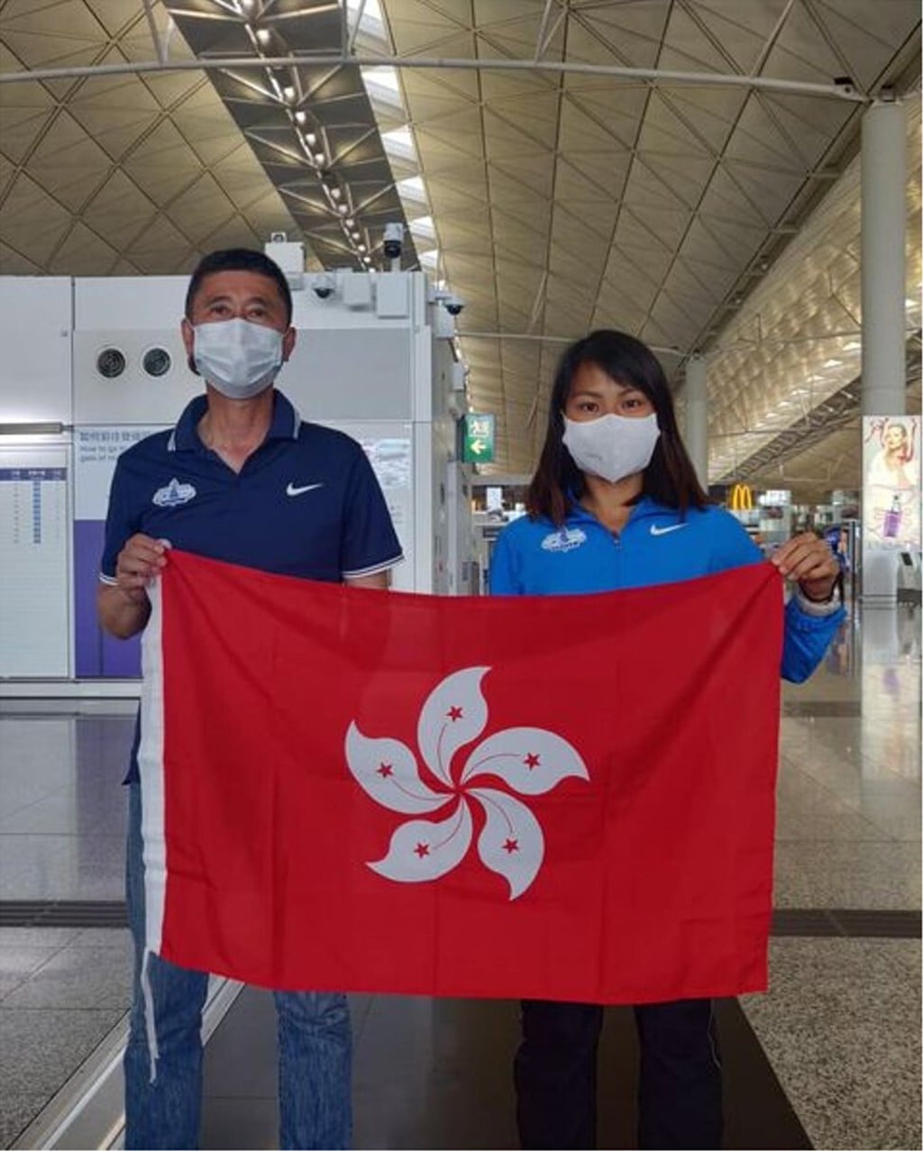 Christy Yiu and coach Shinetsu Murao at Hong Kong International Airport before leaving for Milan. Photo: HKAAA