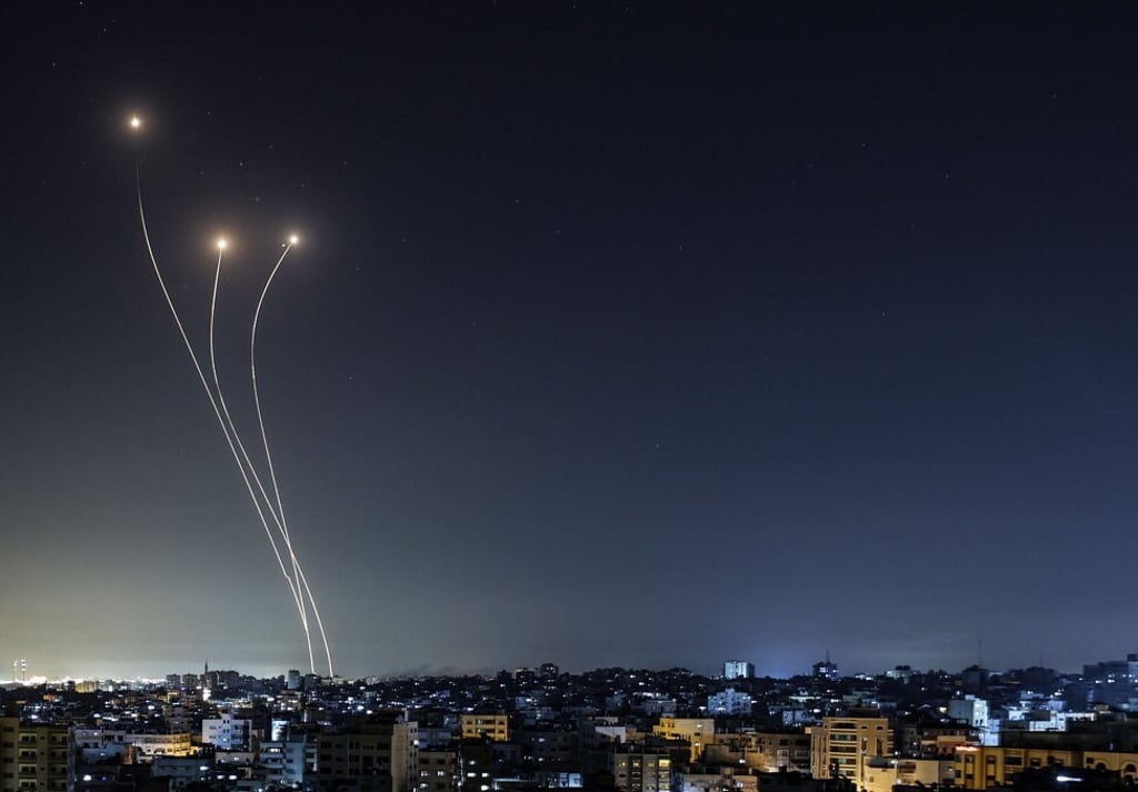 A streak of light appears as Israel‘s Iron Dome anti-missile system intercepts rockets launched from the Gaza Strip early on Monday. Photo: AFP