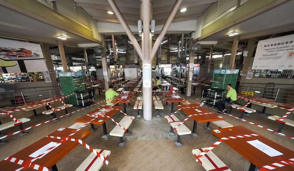 Tables are cordoned off at a hawker centre in Singapore. Photo: EPA-EFE