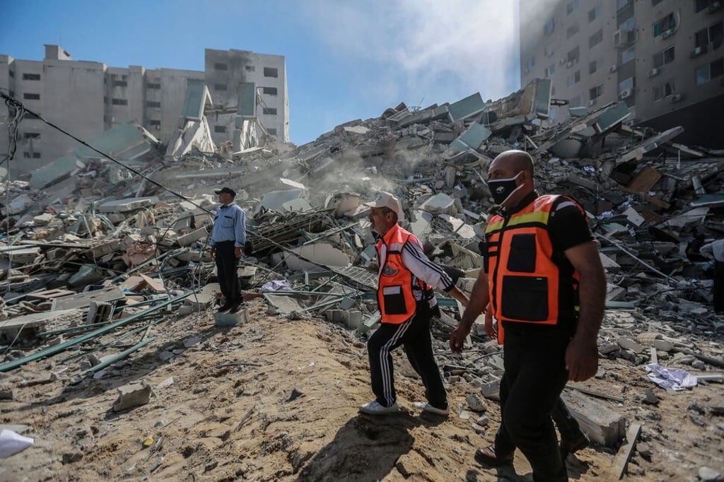 Palestinian paramedics inspect the remains of of the al-Jala Tower, which housed several media outlets. Photo: dpa Palestinian paramedics inspect the remains of of the al-Jala Tower, which housed several media outlets. Photo: dpa