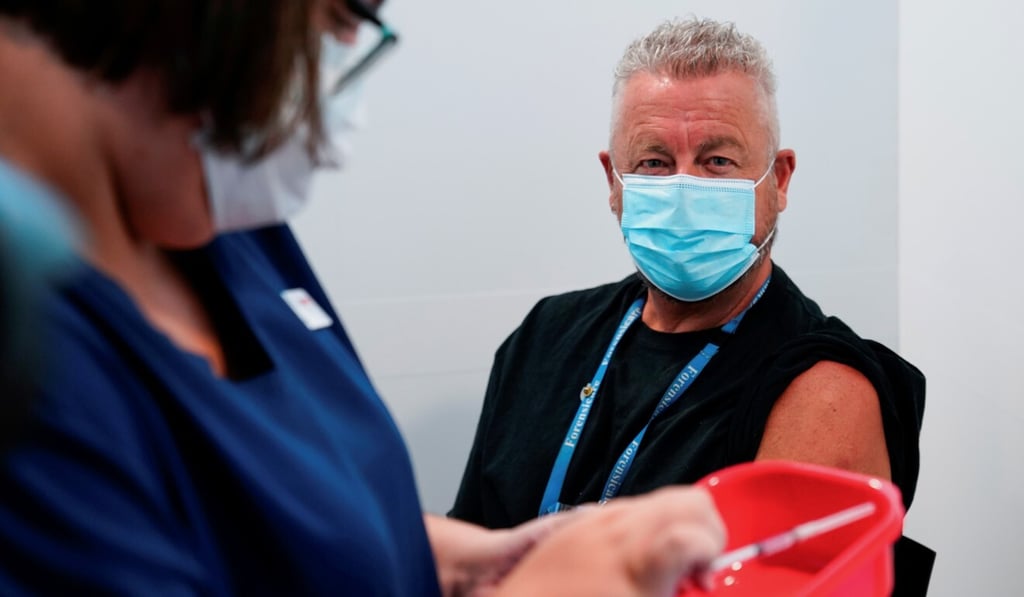 A doctor waits to get a Pfizer Covid-19 shot in Melbourne, Australia. Photo: Reuters A doctor waits to get a Pfizer Covid-19 shot in Melbourne, Australia. Photo: Reuters