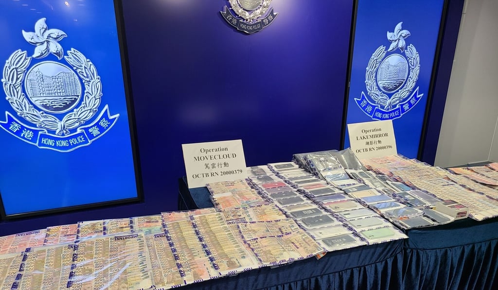 Officers seized cash, mobile phones and computers as part of the operation. Photo: Ng Kang-chung