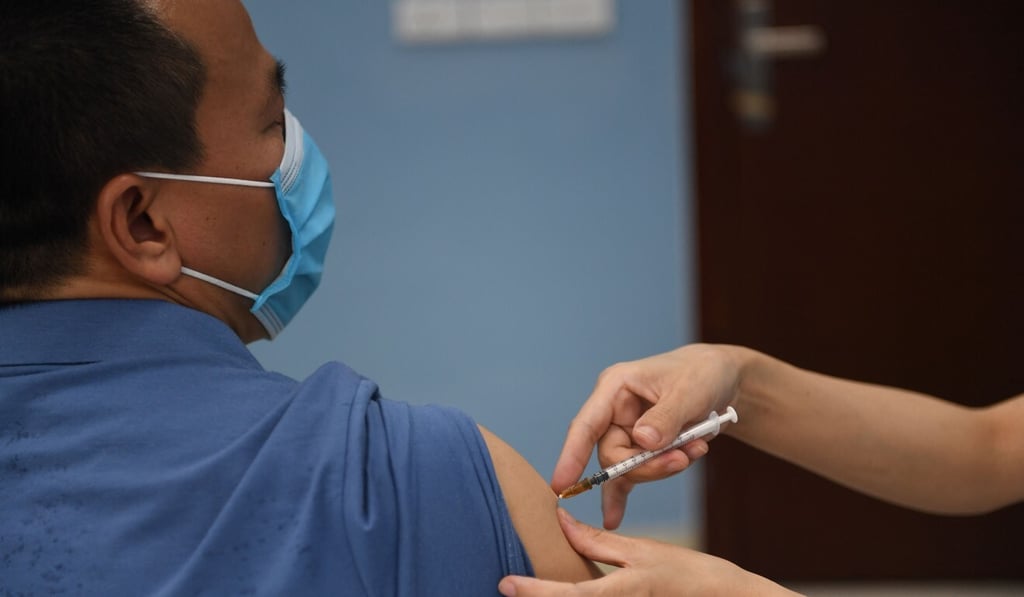 A health worker administers a dose of the AstraZeneca Covid-19 vaccine at a hospital in Hanoi this week. Photo: AFP A health worker administers a dose of the AstraZeneca Covid-19 vaccine at a hospital in Hanoi this week. Photo: AFP
