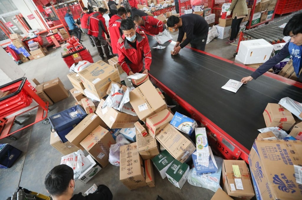 Workers sort out packages for delivery at JD.com’s Yizhuang Smart Delivery Station in Beijing. Photo: SCMP Workers sort out packages for delivery at JD.com’s Yizhuang Smart Delivery Station in Beijing. Photo: SCMP