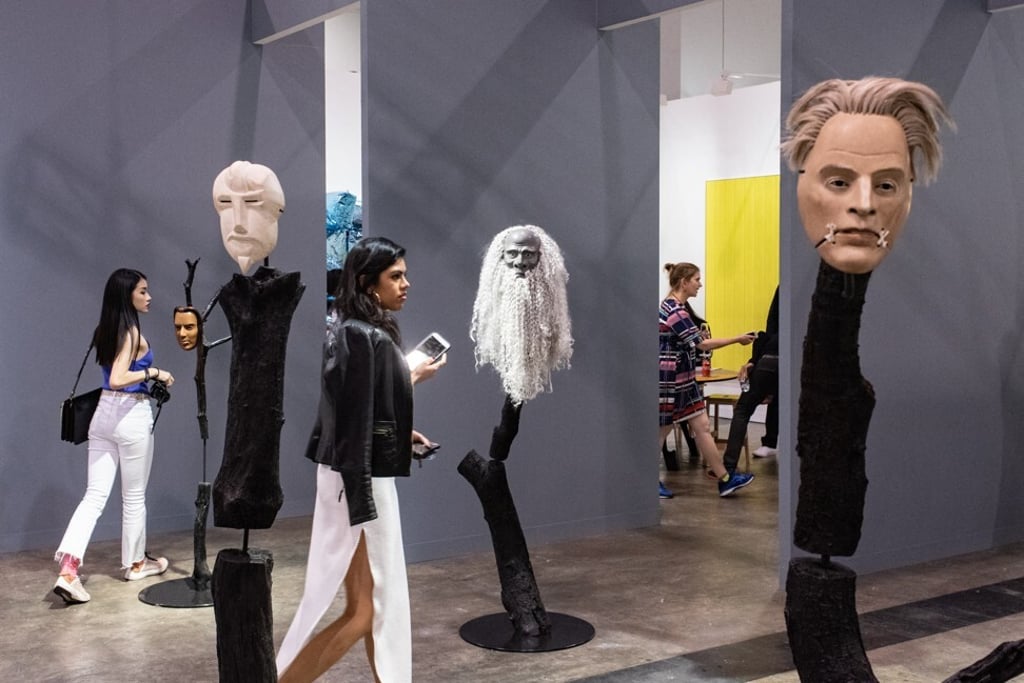 Visitors walk past Simon Starling's work At Twilight: W.B. Yeats during the 2019 Art Basel Hong Kong fair. Photo: AFP Visitors walk past Simon Starling's work At Twilight: W.B. Yeats during the 2019 Art Basel Hong Kong fair. Photo: AFP