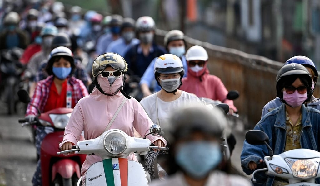 Commuters in Hanoi, Vietnam. Photo: AFP Commuters in Hanoi, Vietnam. Photo: AFP