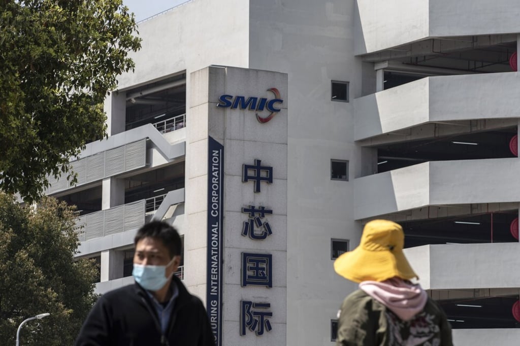 Pedestrians walk past the Semiconductor Manufacturing International Corp headquarters in Shanghai on March 23, 2021. Photo: Bloomberg Pedestrians walk past the Semiconductor Manufacturing International Corp headquarters in Shanghai on March 23, 2021. Photo: Bloomberg