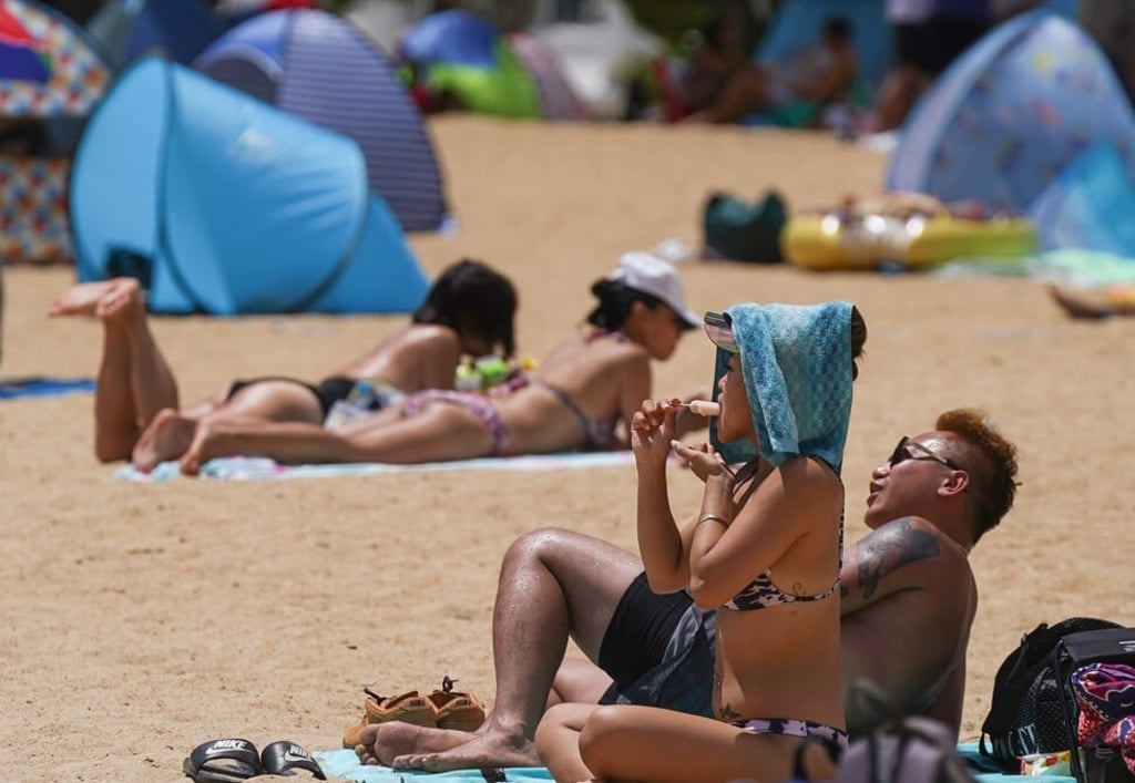 A couple soak up the sun at Repulse Bay. Photo: Sam Tsang A couple soak up the sun at Repulse Bay. Photo: Sam Tsang