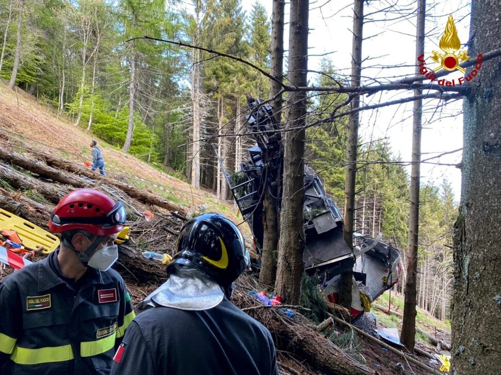 Rescuers works at the site of the crash in the Piedmont region. Photo: Vigili del Fuoco / AFP Rescuers works at the site of the crash in the Piedmont region. Photo: Vigili del Fuoco / AFP