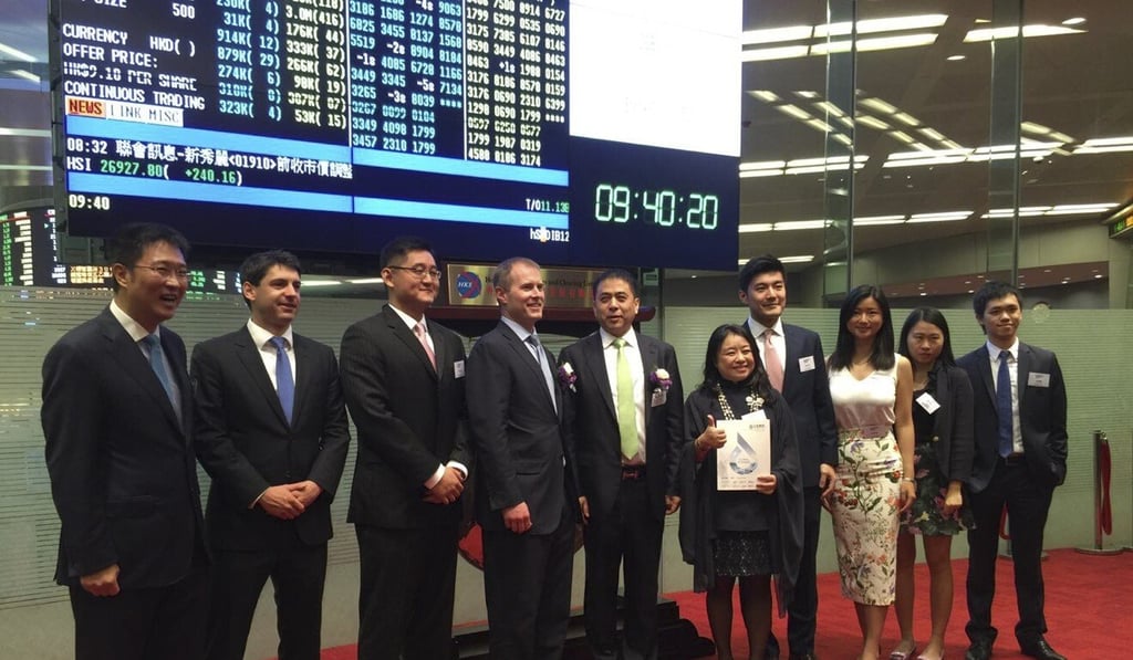 Simone Song (fifth from right) at the Hong Kong stock exchange for the IPO of a Chinese biotech company in 2015. Shortly afterwards, a colon health scare led her to quit banking and found health care venture capital fund ORI Capital. Photo: courtesy of Simone Song