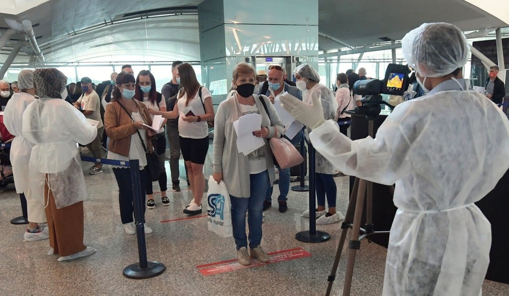 Tunisian health workers monitor European tourists upon their arrival at Enfidha-Hammamet International Airport. Photo: AFP Tunisian health workers monitor European tourists upon their arrival at Enfidha-Hammamet International Airport. Photo: AFP