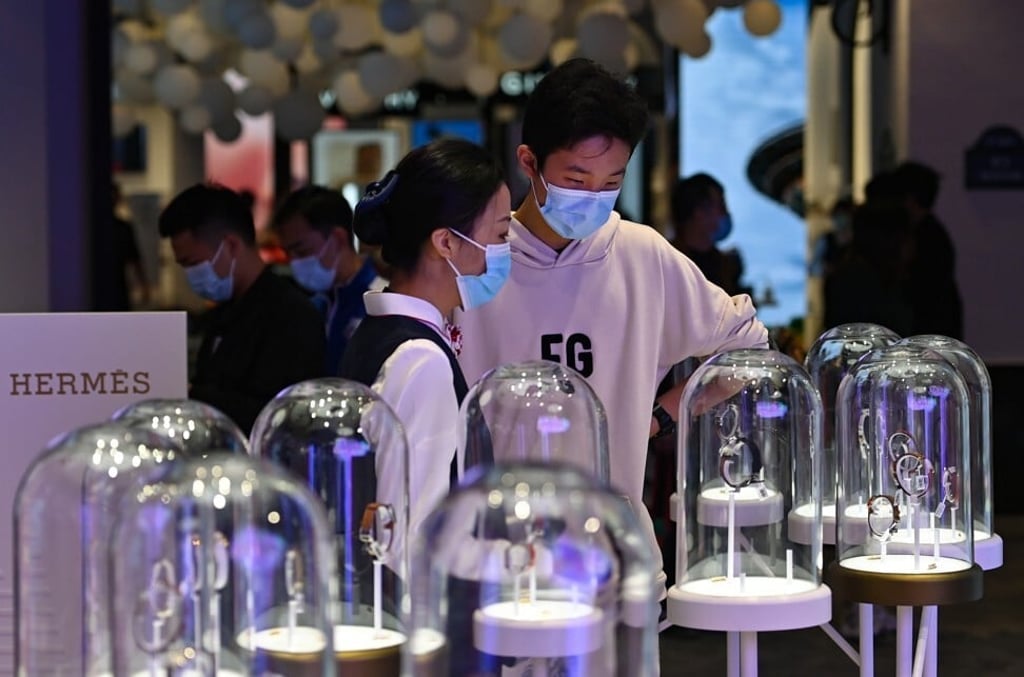 Customers visit a duty-free shop in Haikou, Hainan island. Photo: Xinhua/Guo Cheng