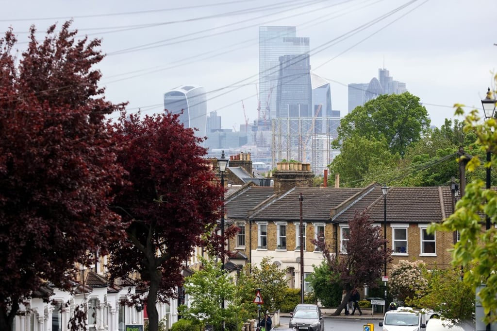 Skyscrapers in the City of London beyond residential properties in London, on Friday, May 21, 2021. Photo: Bloomberg.