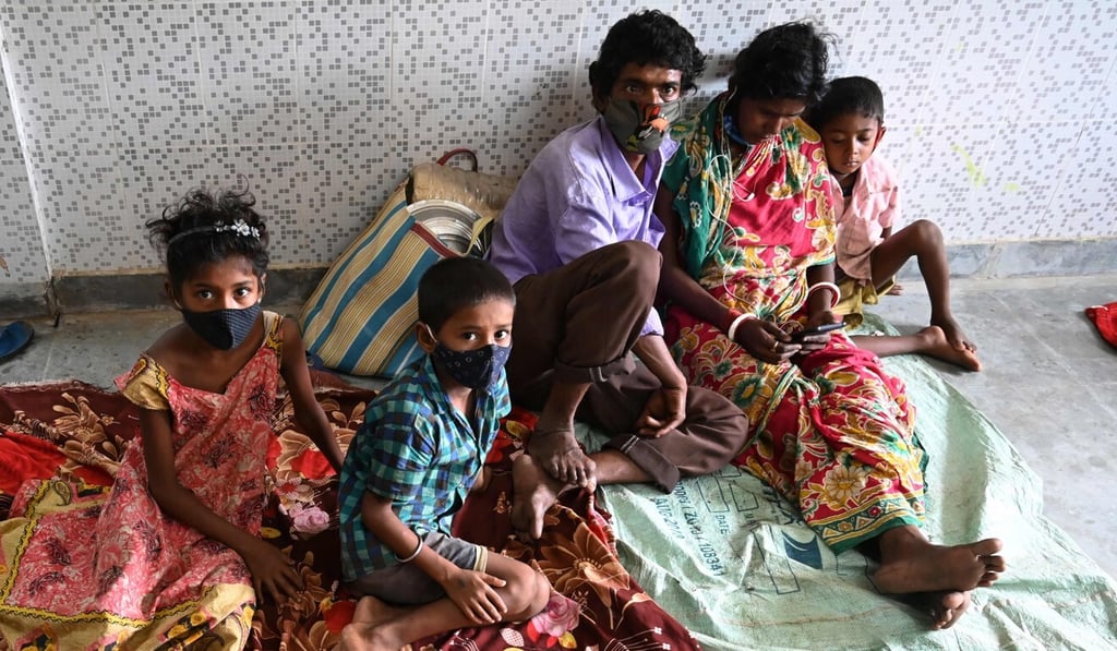 Villagers rest at an emergency shelter. Photo: AFP Villagers rest at an emergency shelter. Photo: AFP