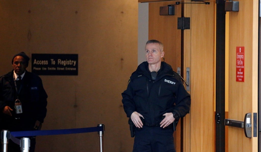 A member of BC Sheriff Service keeps watch outside a courtroom in the BC Supreme Court complex in 2018. Photo: Reuters A member of BC Sheriff Service keeps watch outside a courtroom in the BC Supreme Court complex in 2018. Photo: Reuters