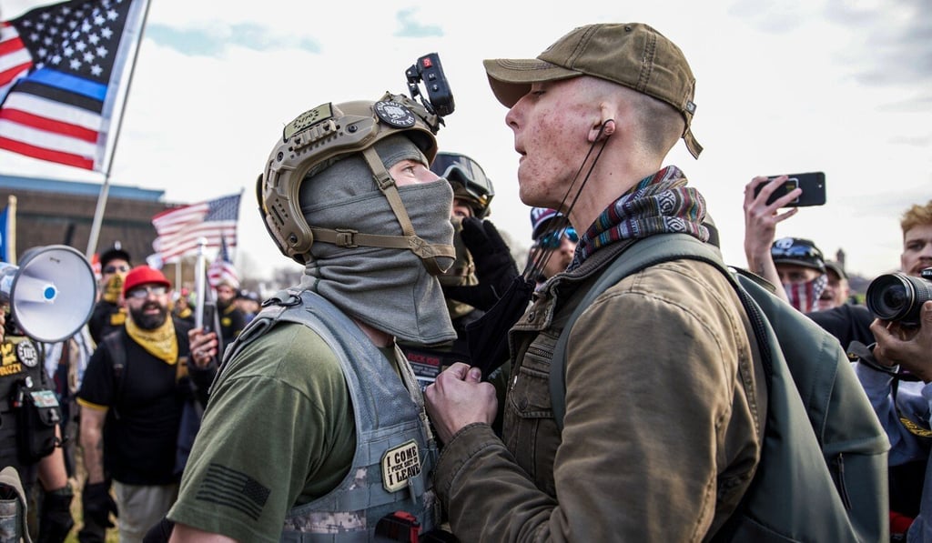 A member of the far-right, neo-fascist and male-only political organisation “Proud Boys” clashes with another member of the left-wing anti-fascist political movement “Antifa” during a protest in support of President Donald Trump, on December 12, 2020 in Washington. Photo: ZUMA /dpa