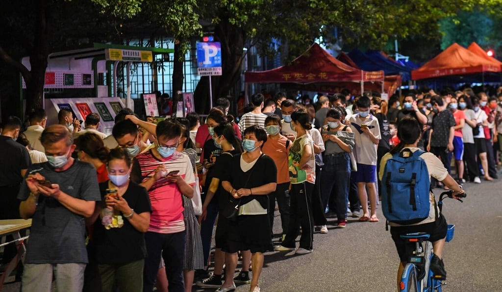 Residents wait for testing in the Liwan district of Guangzhou. Photo: Xinhua Residents wait for testing in the Liwan district of Guangzhou. Photo: Xinhua