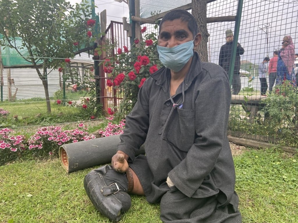 Ghulam Mohammad Dar in the garden next to his cottage in the Bahar-Aar Sanatorium. Photo: Handout