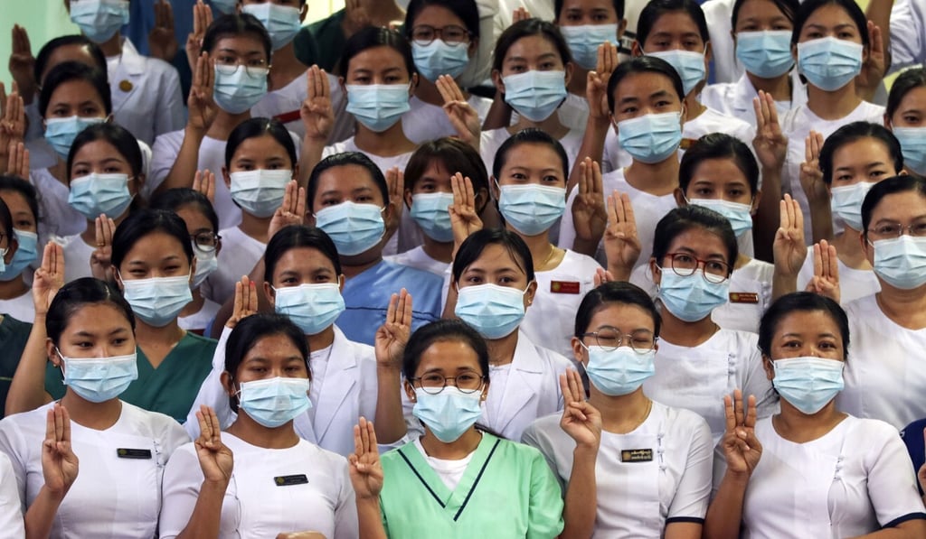 Medical workers gather in front of a hospital in Naypyidaw to show their opposition to the military coup. Photo: EPA