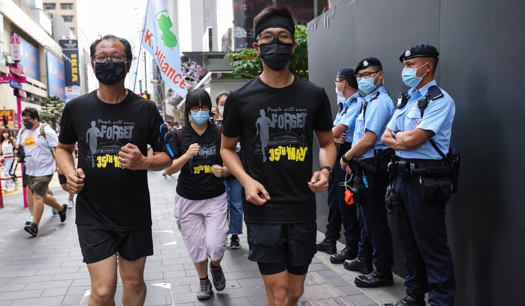 Members of Hong Kong Alliance in Support of Patriotic Democratic Movements organised “Never Forget June 4”, a 32nd Anniversary long-distance run from Victoria Park to the central government’s liaison office in Hong Kong in Sai Ying Pun. Photo: SCMP / Nora Tam