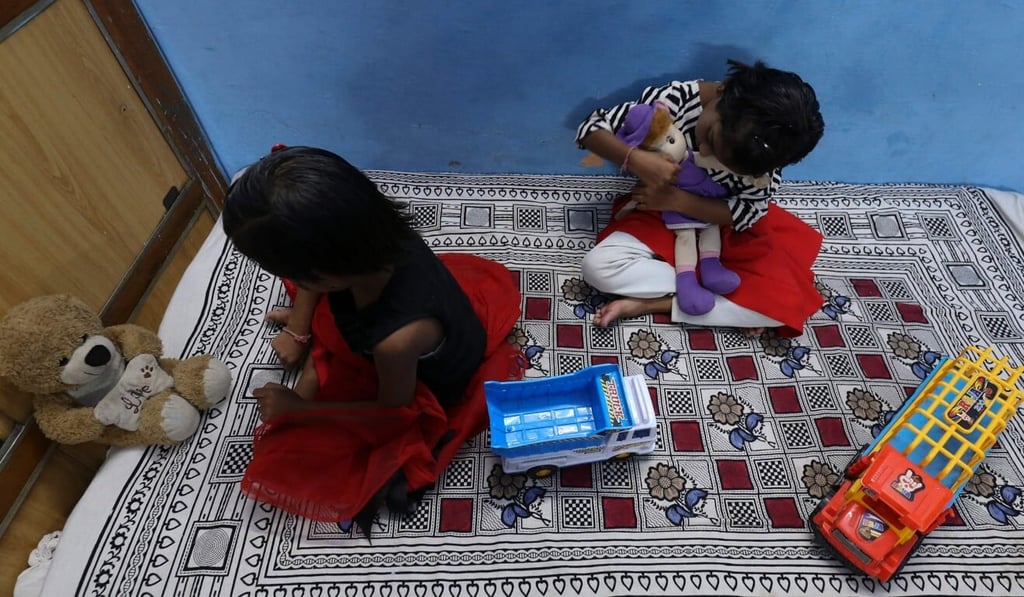 Indian children such as twin sisters Tripti and Pari, who lost both their parents to Covid-19, will be given free education and health insurance. Photo: AFP