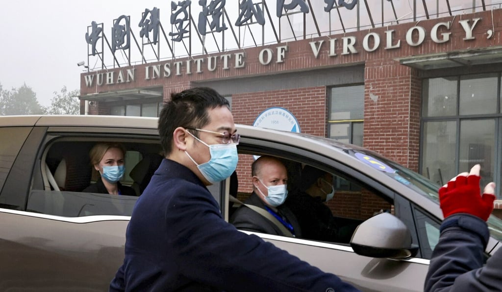 Thea Fischer (left), Peter Daszak (right) and other members of the WHO team arrive at the Wuhan Institute of Virology during their China mission in February. Photo: Reuters