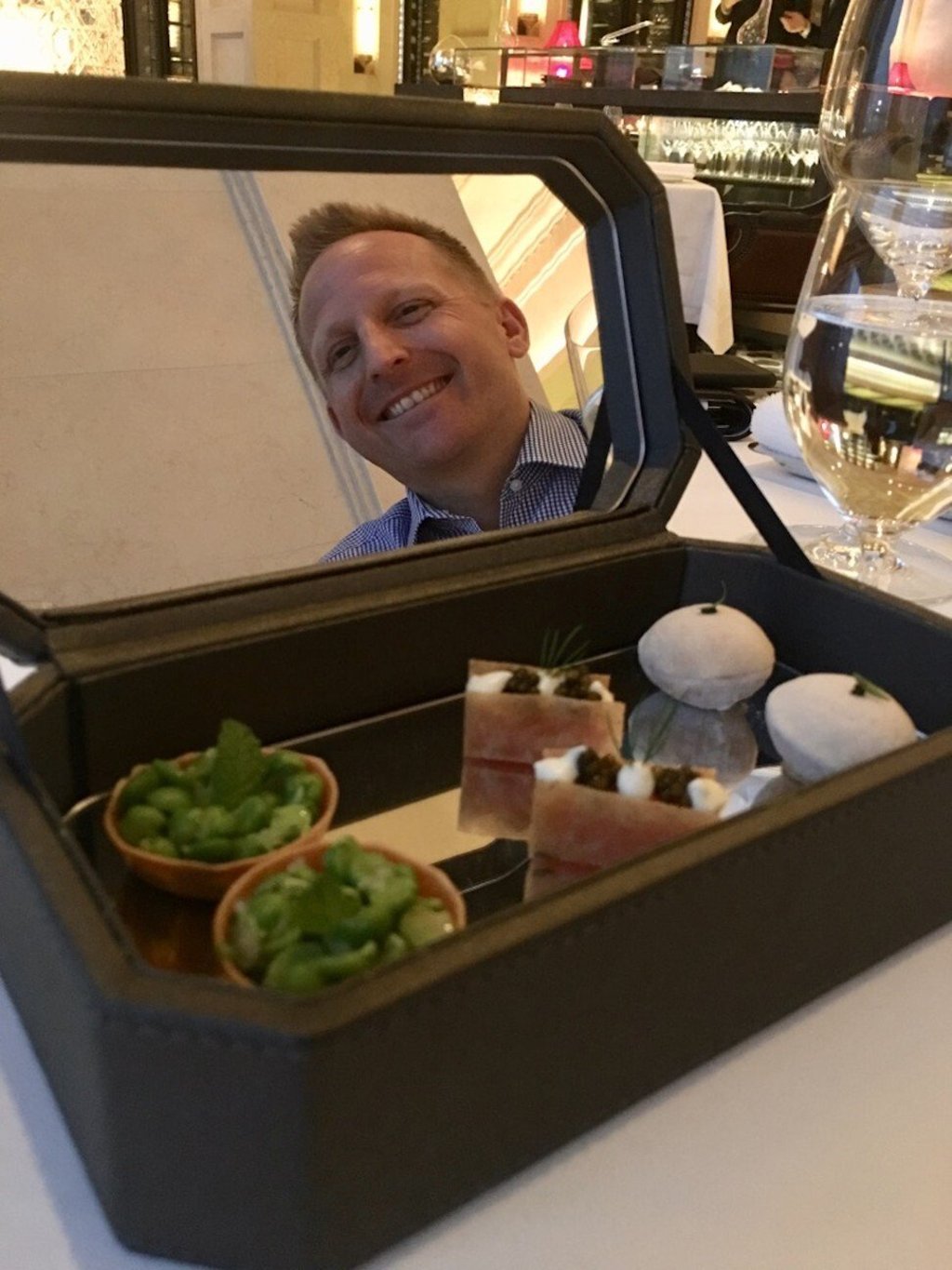 Caprice’s dessert box with Mirabel’s husband in the reflection. Photo: Mirabel Rosar