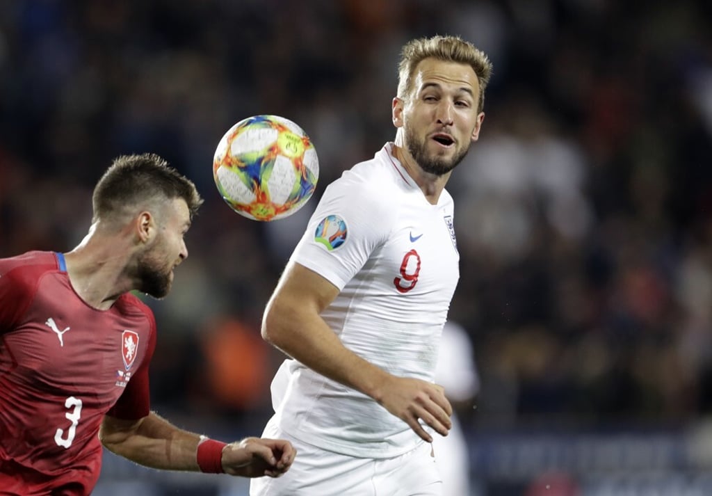 Harry Kane duels for the ball with Czech Republic’s Ondrej Celustka. Photo: AP